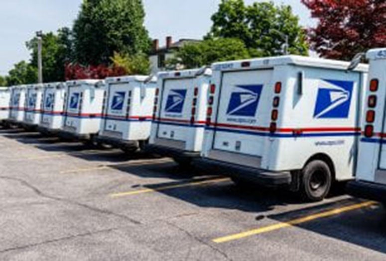 Postal Trucks parked next to each other