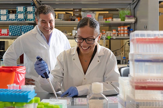 Rice University bioengineers Omid Veiseh (left) and Amanda Nash are working with colleagues at the University of Texas MD Anderson Cancer Center and elsewhere to develop small "drug factory" implants to treat cancer
