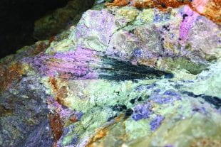 Black tourmaline going to pink tourmaline within a quartz pegmatite at California's Stewart Lithia mine. (Photo by Patrick Phelps/Rice University)