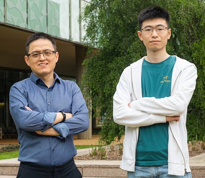 Rice University materials scientist Jun Lou, left, and graduate student Boyu Zhang were part of the team that printed 3D lattices of glass and crystal with sub-200 nanometer resolution. (Credit: Jeff Fitlow/Rice University)