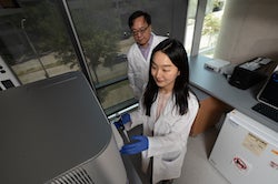 Researchers Gang Bao and Julie Park prepare to sequence a sample at their Rice University lab. They led a study to reveal potential threats to the efficacy of CRISPR-Cas9 gene editing from unseen changes that accompany on-target edits. (Credit: Jeff Fitlow/Rice University)