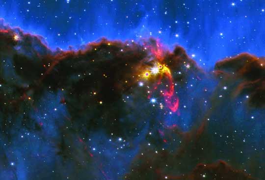 false-color infrared image from the Webb Space Telescope of a star-forming region in the constellation Carina