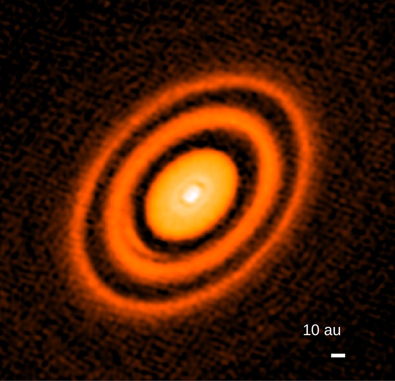 false-color image from ALMA radio telescope showing rings around young star HD163296