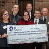 Rice University presents a check to United Way for $250,000.