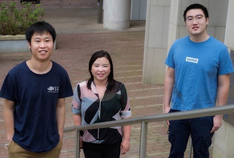 Rice University chemical and biomolecular engineer Xue Sherry Gao, with graduate students Qichen Yuan, left, and Zane Zeng, has won a prestigious National Institutes of Health grant to develop personalized gene editing techniques for cystic fibrosis. (Credit: Jeff Fitlow/Rice University)
