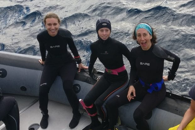 Rice University marine biologists (from left) Lauren Howe-Kerr, Amanda Shore and Adrienne Correa prepare for a research dive at the Flower Garden Banks National Marine Sanctuary in October 2018. (Photo by Carsten Grupstra/Rice University)