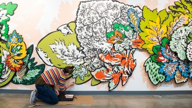 "Power Flower" covers the wall of a first-floor corridor in the M.D. Anderson Biological Laboratories building. (Photo by Jeff Fitlow)