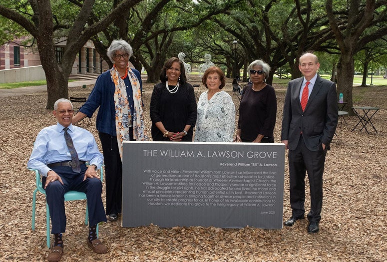 Rev. William Lawson visits namesake grove at Rice for first time with family.