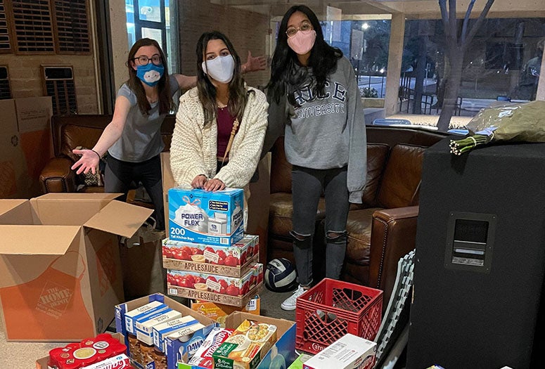 Students standing with snacks