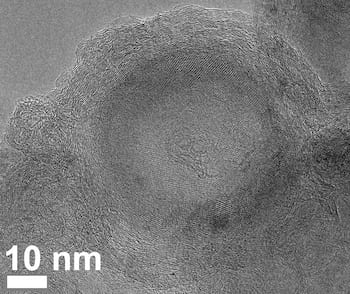 An electron microscope image shows a late stage in the evolution of carbon and fluorine atoms under flash Joule heating. The carbon atoms form concentric shells around a nanodiamond core. As heating proceeds, the diamond phase is replaced by the shell. (Credit: Tour Group/Rice University)