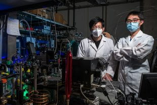 Research by graduate students Minhan Lou (left) and Lin Yuan of Rice University's Laboratory for Nanophotonics found that a nanocatalyst's shape affects its ability to photocatalyze important chemical reactions. (Photo by Jeff Fitlow/Rice University)