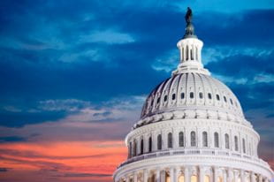 Capitol building with red and blue sky