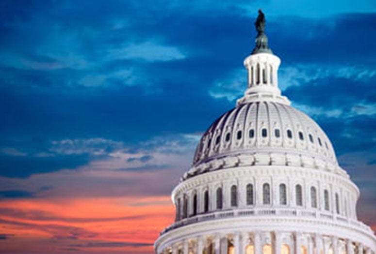 Capital Building with red and blue sky backdrop. 