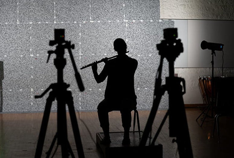 Backlighting required for schlieren imaging experiments produced this silhouette of Houston Symphony flutist Kathryn Ladner '12.