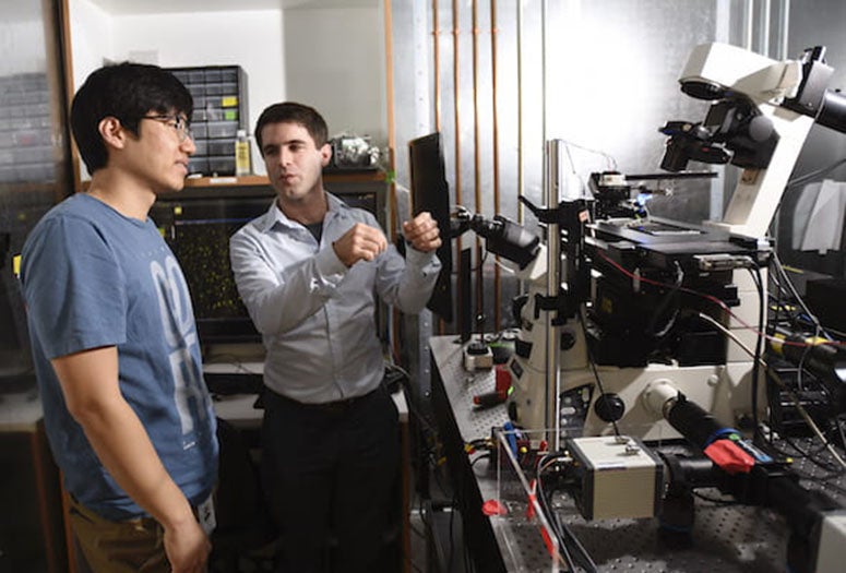 Rice graduate student Jihwan (James) Lee and François St-Pierre of Baylor College of Medicine and Rice stand at their SPOTlight device in December 2019. They and their colleagues developed the platform to speed the sorting of cells while making the process more versatile. Photo by Agapito Sanchez Jr./Baylor College of Medicine