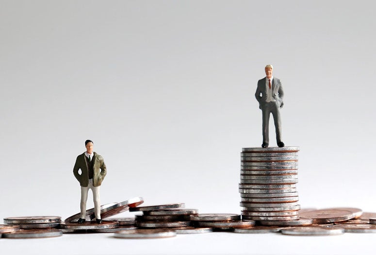 Illustration with man standing on coins. 
