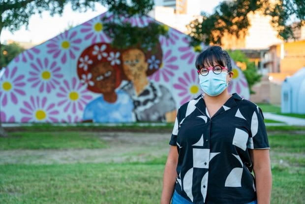 Houston artist Jasmine Zelaya stands in front of her piece at Rice, “Detroit Red.” (Photo credit: Brandon Martin/Rice University)