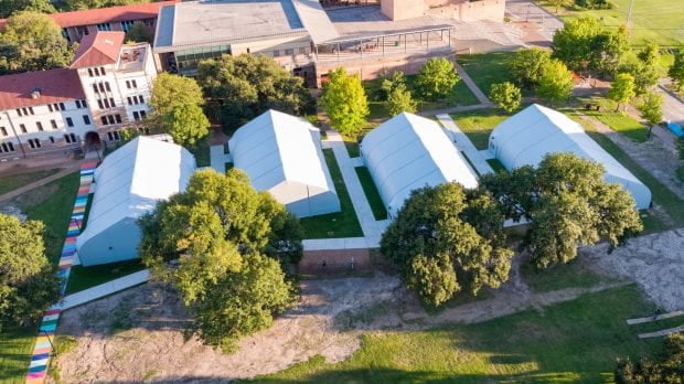 An aerial view shows the four temporary classrooms at Alumni Drive and College Way. (Photo credit: Brandon Martin/Rice University)