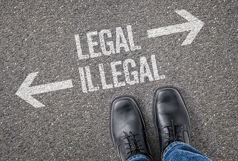 Feet with two arrows on the ground. One going right labeled "legal" and another one going left labeled "illegal" 