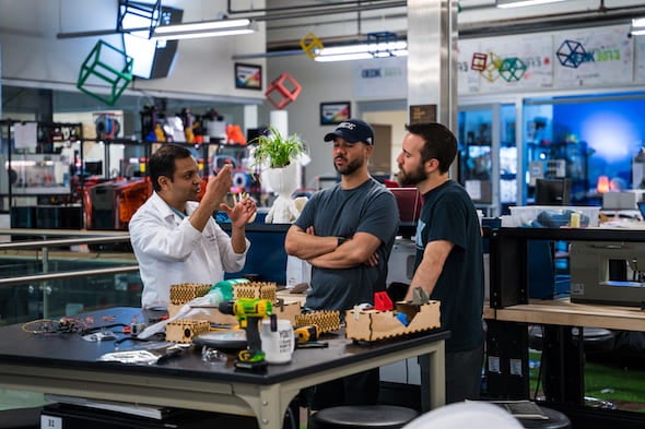 Rice University staff, students and partners have developed an automated bag valve mask ventilator unit. Working at Rice’s Oshman Engineering Design Kitchen, from left: Dr. Rohith Malya, engineering design technician Fernando Cruz and supervisor Danny Blacker. Photo by Brandon Martin