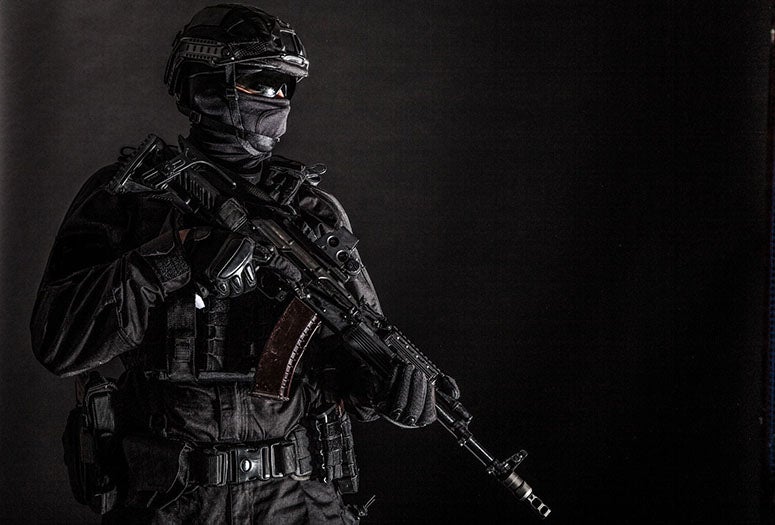 Elite police squad member in tactical ammunition