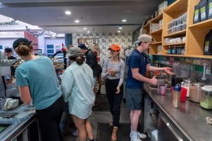 Students making coffee in the coffee shop