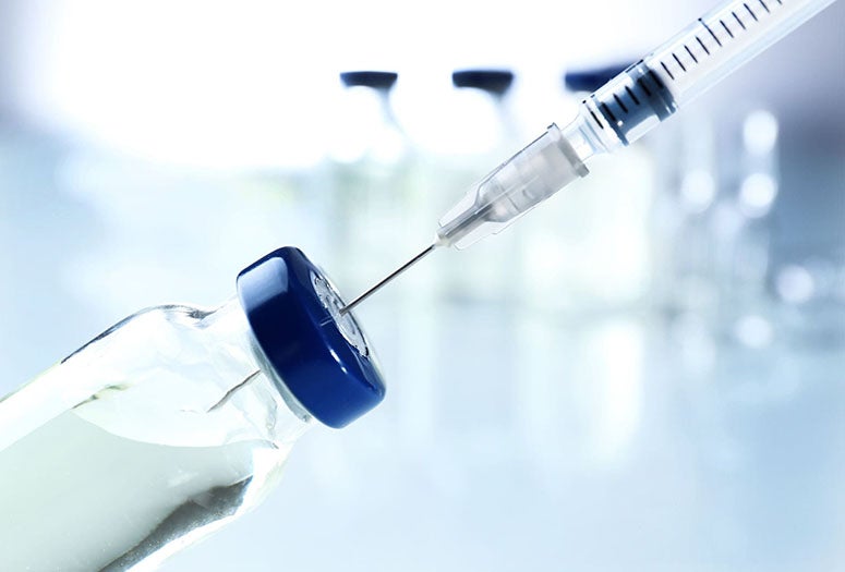 Syringe being filled. 