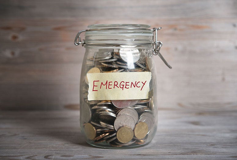 Emergency Savings Jar with coins inside