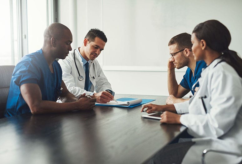 Doctors sitting in a conference room