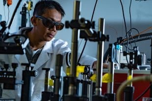 Linan Zhou, a postdoctoral researcher at Rice University's Laboratory for Nanophotonics, designed a copper-ruthenium photocatalyst for making syngas via a low-energy, low-temperature, dry-reforming process. (Photo by Jeff Fitlow/Rice University)
