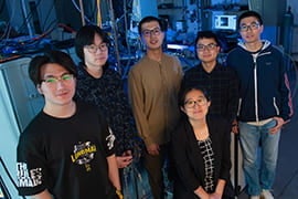 Rice University physicists (clockwise from left) Yichen Zhang, Ruohan Wang, Yucheng Guo, Jianwei Huang, Han Wu and Ming Yi are members of a Rice-led team that discovered a room-temperature transition between 1D and 2D electrical conduction states in topological crystals of bismuth and iodine. Photo by Jeff Fitlow