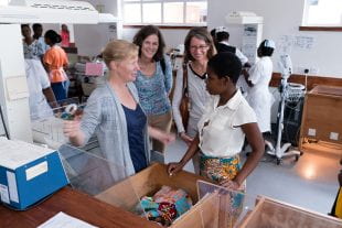 Rice University bioengineers Maria Oden (second from left) and Rebecca Richards-Kortum (second from right) observe as Malawi College of Medicine pediatrician Josephine Langton (left) speaks with the mother of a baby receiving CPAP therapy at Queen Elizabeth Central Hospital in Blantyre, Malawi in 2016. Oden and Richards-Kortum co-founded the Rice 360° Institute for Global Health, which developed the rugged, low-cost neonatal CPAP machine used at the hospital. (Photo by Brandon Martin/Rice University)
