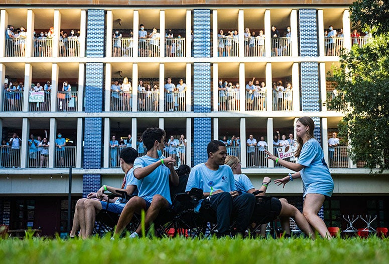 “JIBA” chants and posters from the balconies of Jones College cheered on new students in the commons below playing musical chairs and tossing water balloons as part of their O-Week bonding sessions. (Photos by Jeff Fitlow)