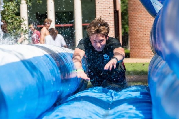 Student sliding on a slide