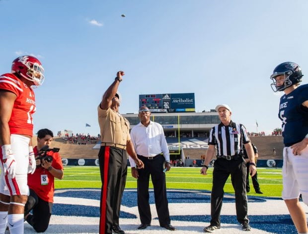 Uniformed Marine doing the coin toss
