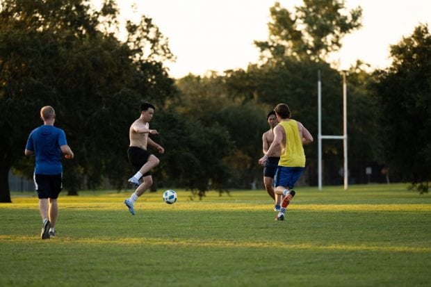 Students playing soccer