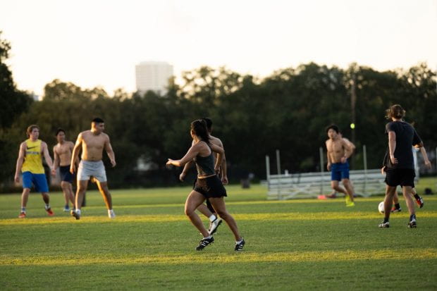 Students playing on a soccer field