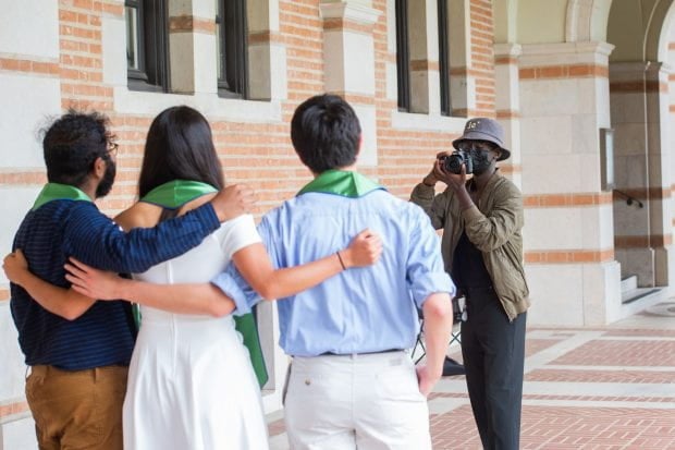 Photos by Jeff Fitlow of students taking pictures of grads