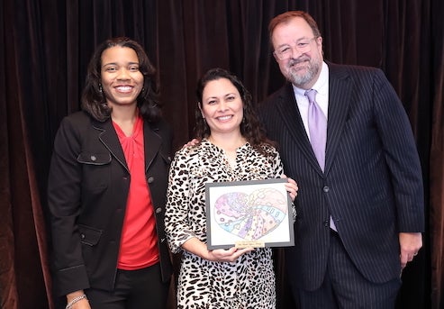 Ruth López Turley receives award from Children At Risk