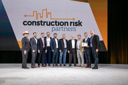 Linbeck Construction representatives accept award.