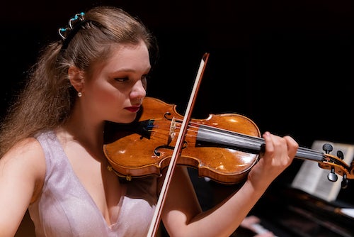 Clara Saitkoulov performs on the Stradivarius violin. Photo by Brandon Martin. 