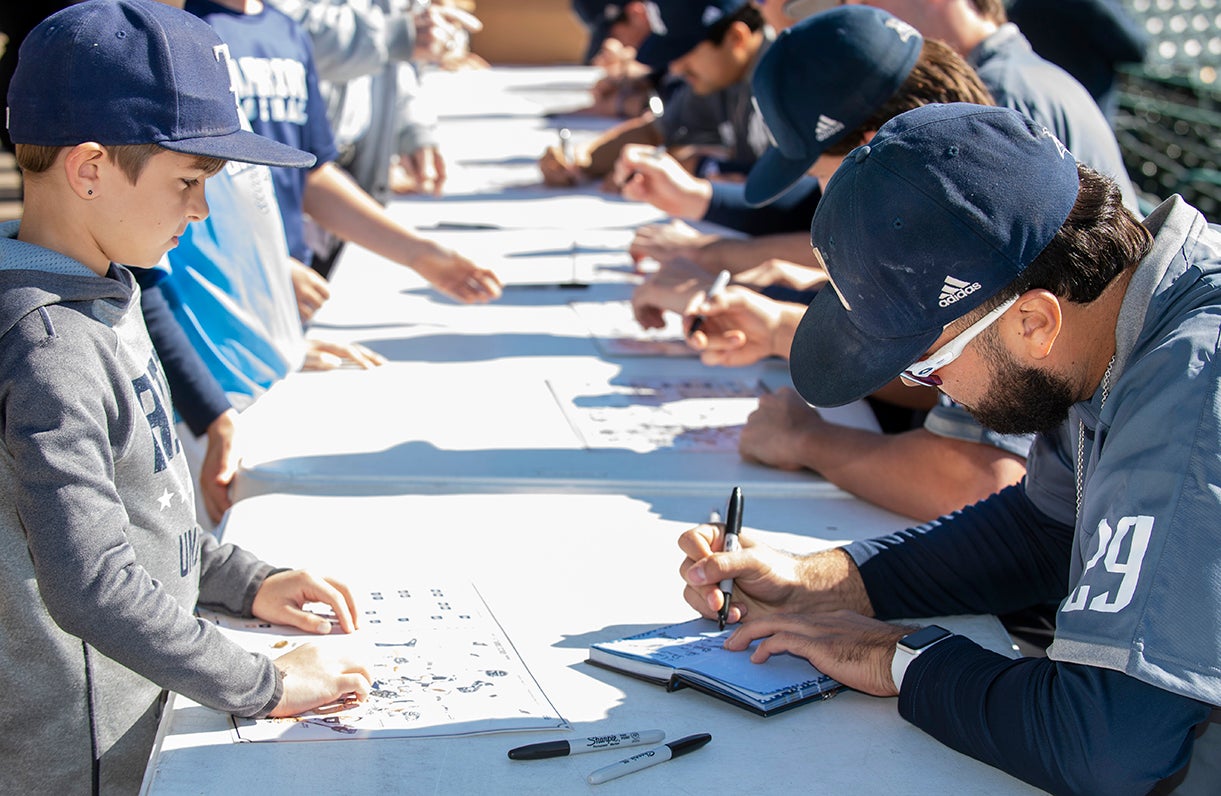 A young fan gets an autograph during the Rice baseball team's annual Fan Fest Jan. 29 at Reckling Park.