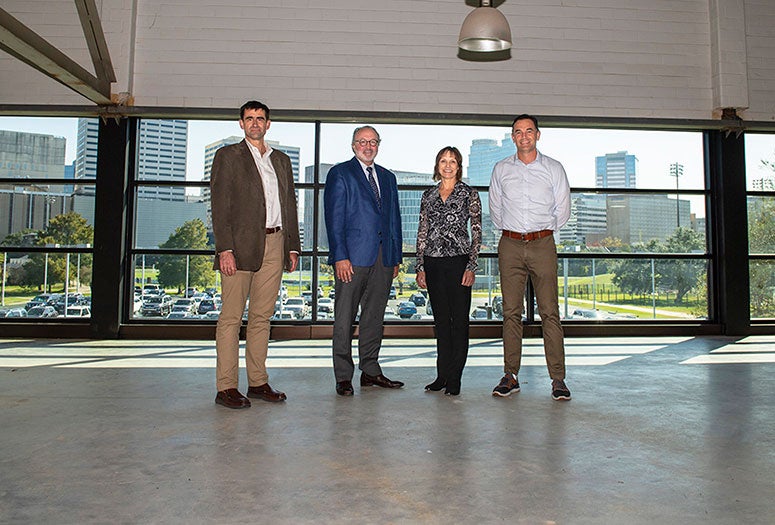 Rice Dean of Natural Sciences Tom Killian, Houston Methodist orthopedic surgeon Patrick McCulloch, Rice Kinesiology Chair Heidi Perkins and Rice Athletics Director Joe Karlgaard in the Tudor Fieldhouse suite that will house the Center for Human Performance.