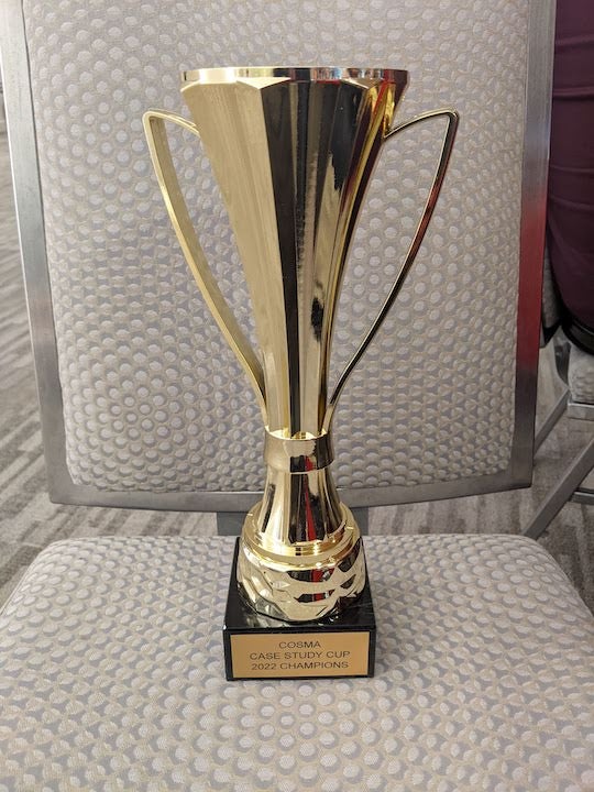 Photo of the COSMA Cup won by Rice Sports Management students.