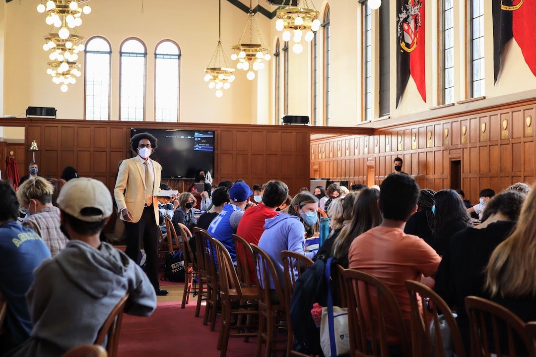 Vice Provost Alex Byrd addresses a group of high school students on a tour at Rice inside the Baker College commons.