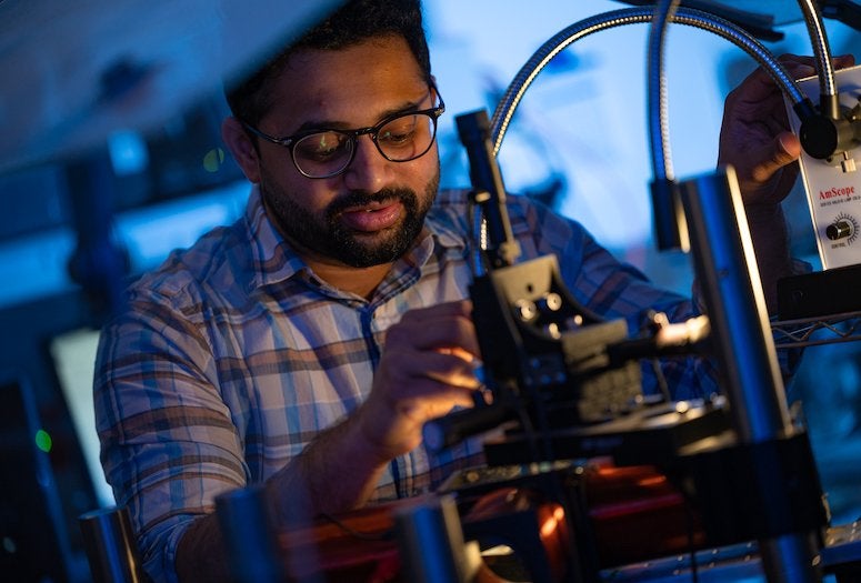Rice postdoctoral fellow Kedar Joshi prepares an experiment at the Biswal Lab to see how magnetic fields will affect a colloid of magnetic particles.