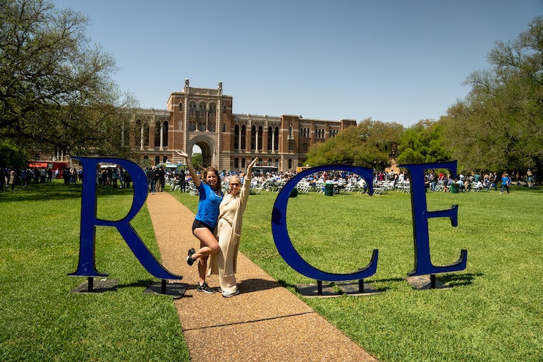 Admitted students and family posing for photos at Rice