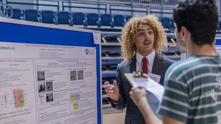 Rice student presenting research at past Rice Undergraduate Research Symposium