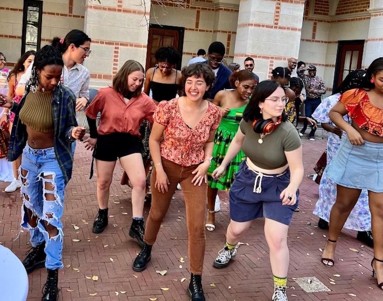 Rice students dance to Angolan music in the courtyard outside the Humanities building March 26, 2022.