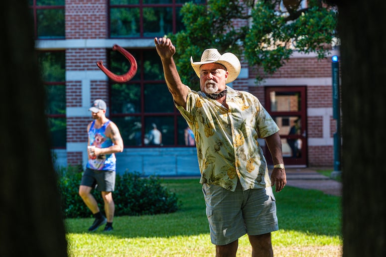 Man throwing horseshoe